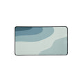 Tide desk mat, muted blue and pale green layers, 12 by 22 inches