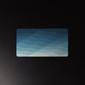 Night Tide desk mat, layered navy to sea-foam waves, 12 by 22 inches