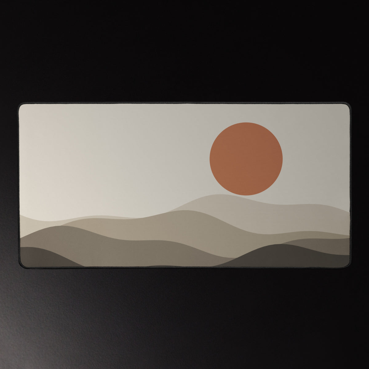 Paper Hills desk mat, terracotta sun over layered hills, 16 by 32 inches