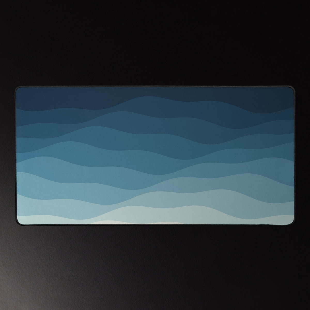 Night Tide desk mat, layered navy to sea-foam waves, 16 by 32 inches